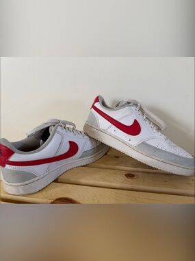 Nike White Low-Top Sneakers with Red Swoosh and Gray Accents